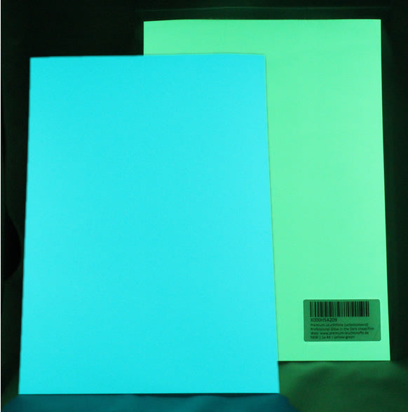 Two glow film sheets A4 side by side in the dark: turquoise-blue on the left, Yellow-Green on the right