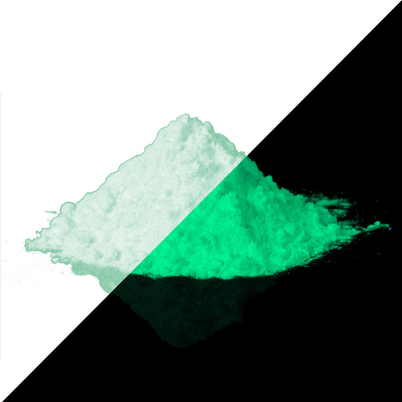Green glow-in-the-dark pigment, half in daylight, half glowing in the dark