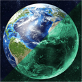 Planet Sticker Earth 30 cm: blue and green in daylight on the left, glowing green in the dark on the right