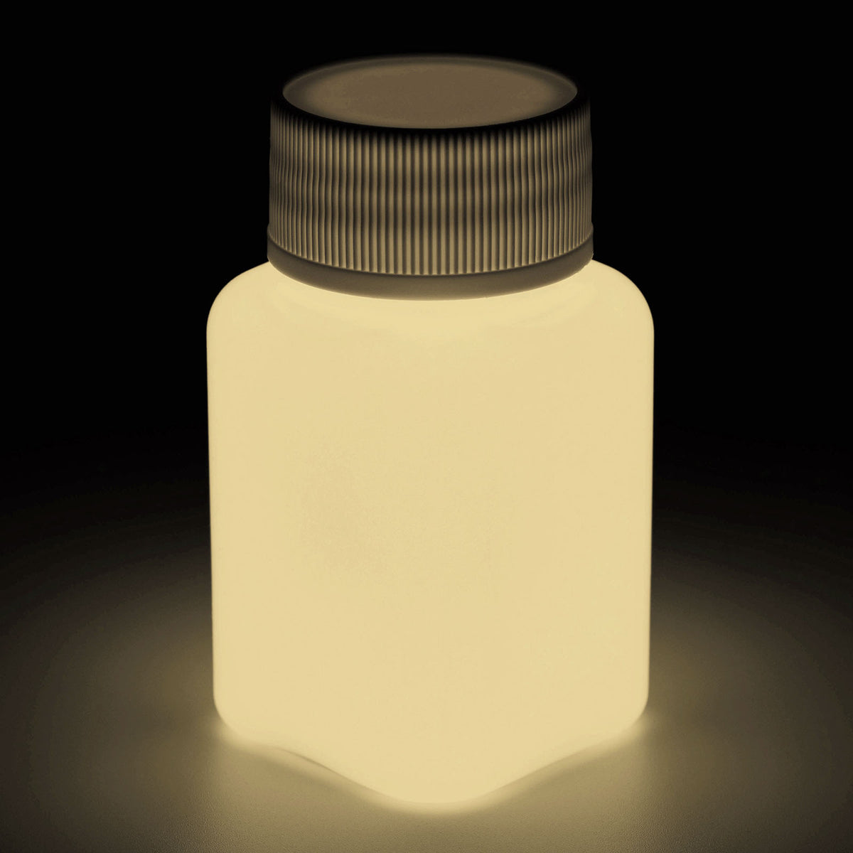 Glow in the dark paint Pink 100 g, bottle in the dark, the paint glowing a pale cream colour