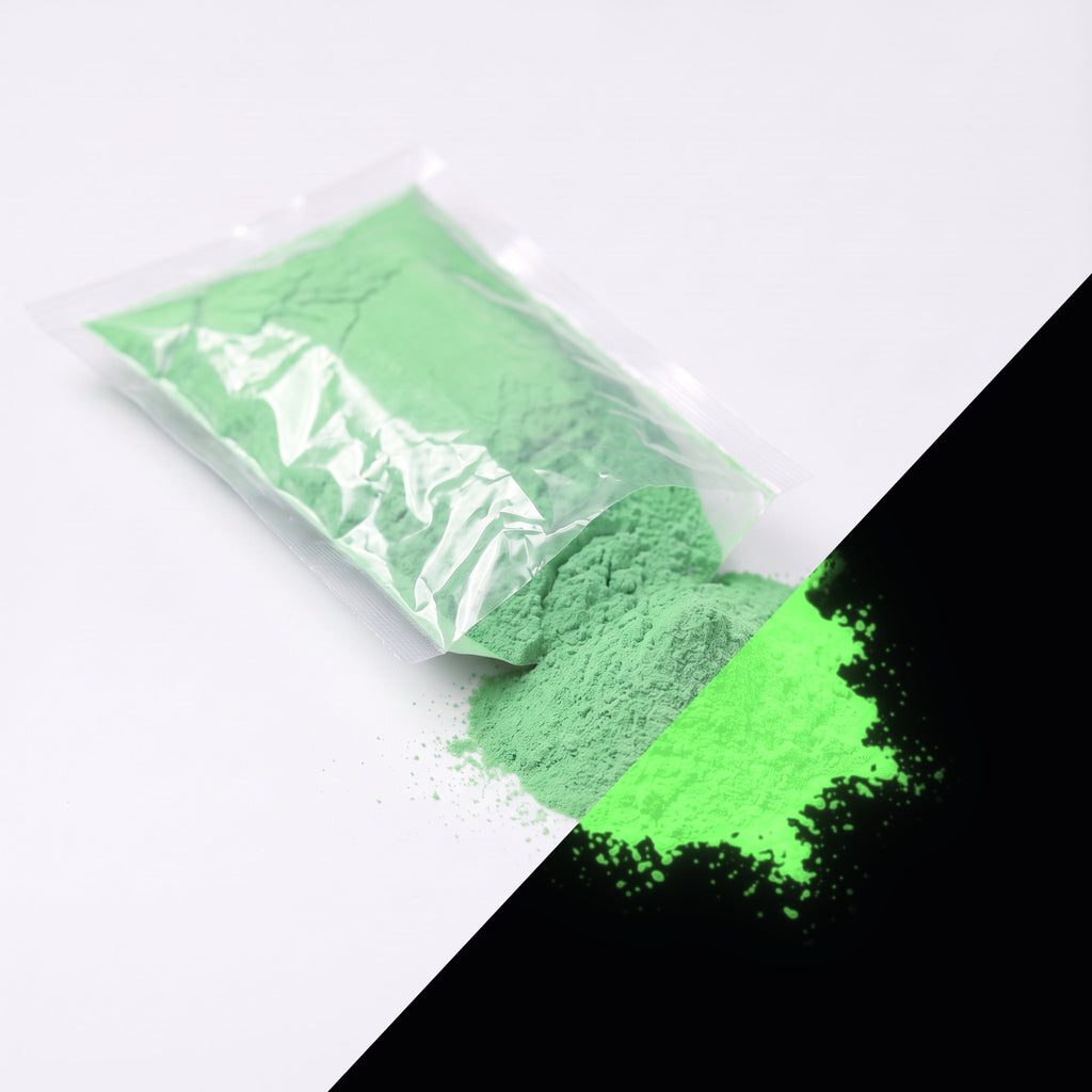 Fine glow pigment Green-Green 100 g: cut-open bag and a small heap of fine powder, green by day, glowing green in the dark (lower right)