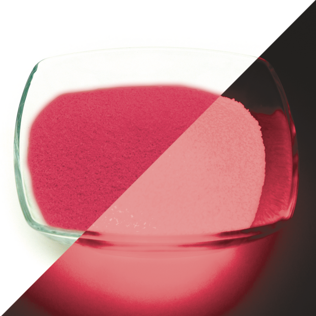Glow Granules Pink 1 mm, 100 g: glass bowl of granules, pink in light on the left, glowing rose in the dark on the right