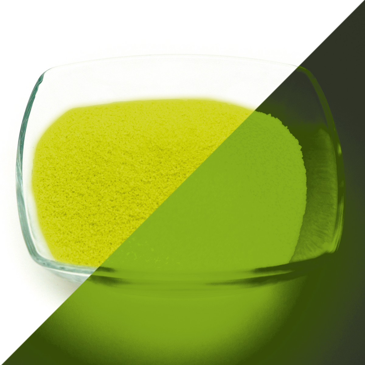 Glow Granules Yellow 1 mm in a glass dish, split view: yellow in daylight on the left, glowing green in the dark on the right