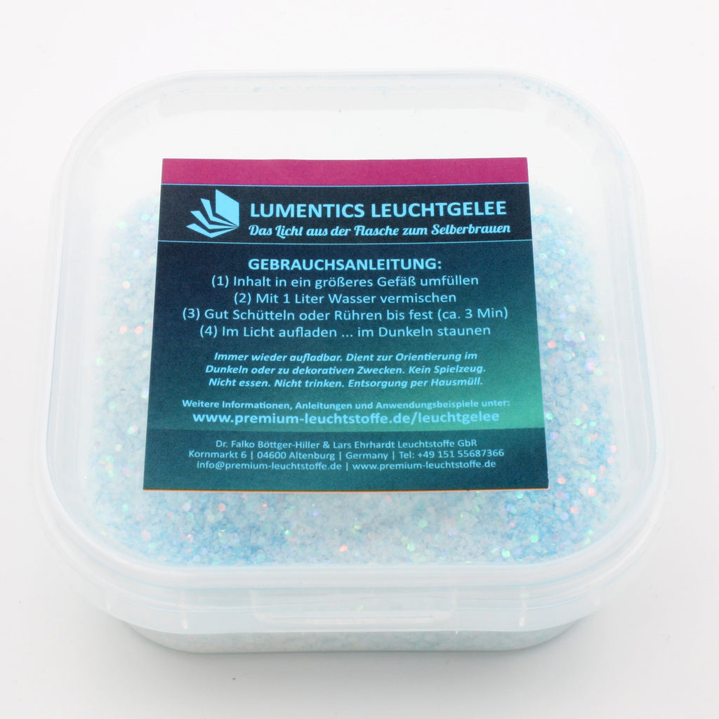 Glow Jelly with Glitter Blue/Blue-Green 45 g in its tub in daylight, light blue with glitter particles