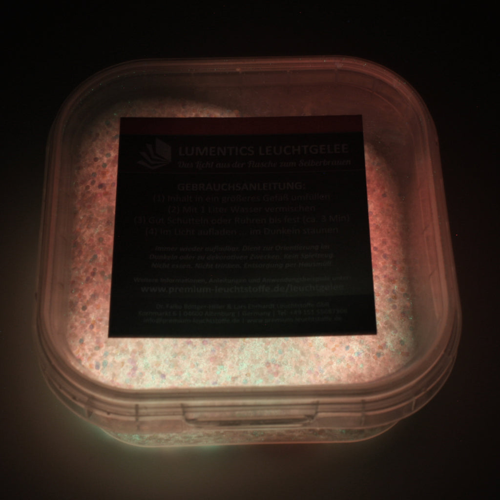 Glow Jelly with Glitter Pink/Yellow-Green 45 g: tub in the dark with the powder faintly glowing