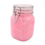 Glow Jelly with Glitter Pink/Yellow-Green: pink glow gel with glitter in a swing-top jar in daylight