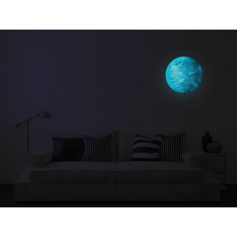 Planet Sticker Blue Planet (Neptune) on the wall above a sofa, glowing blue in the dark