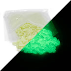 Glow Granules Green 4 mm with an opened bag, daylight on the left, glowing green in the dark on the right
