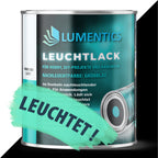 Glow in the Dark Varnish Blue-Green 250 ml: tin, beside it a black area with a green-blue brush stroke