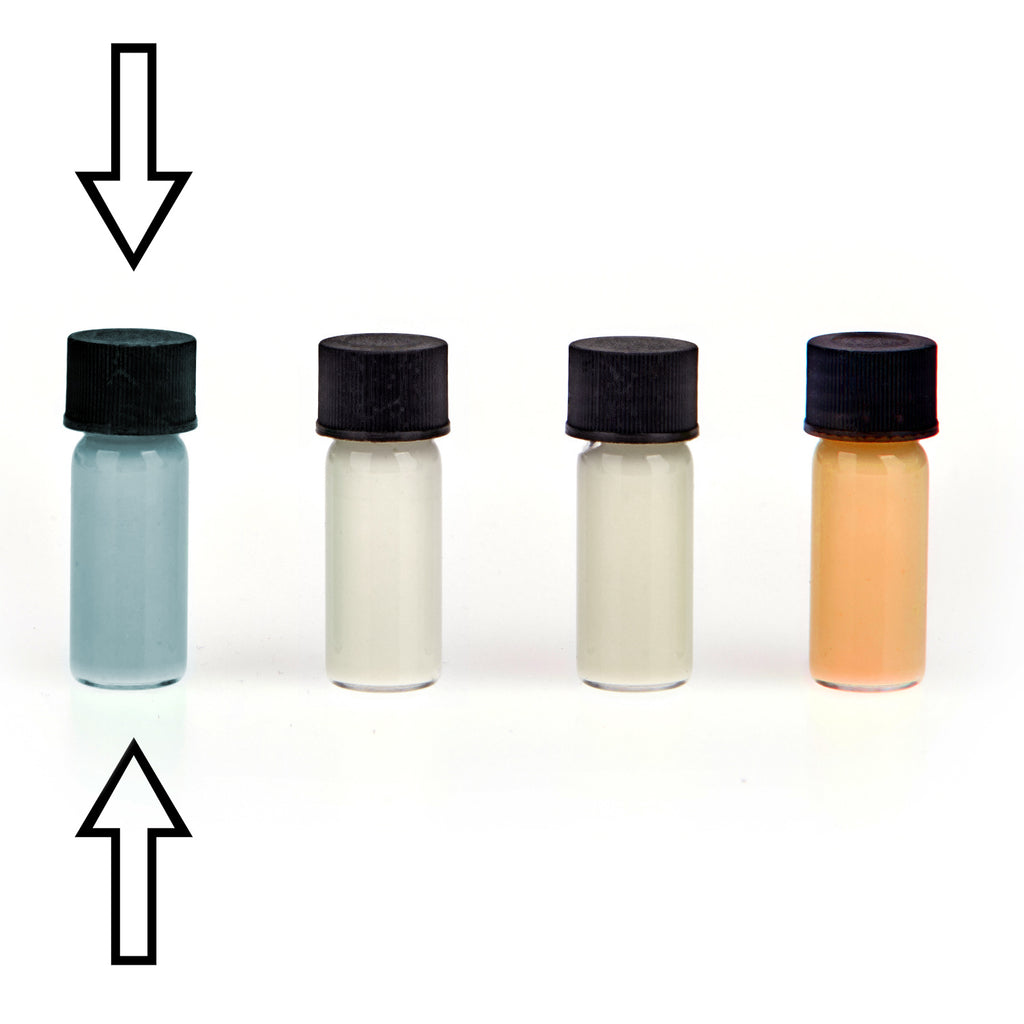 Glow paste: four small vials in blue-grey, white, cream and orange in daylight