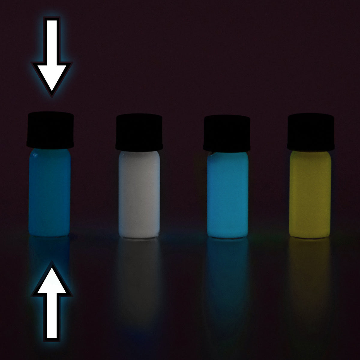 Glow paste: four small vials in the dark, glowing blue, white, light blue and yellow