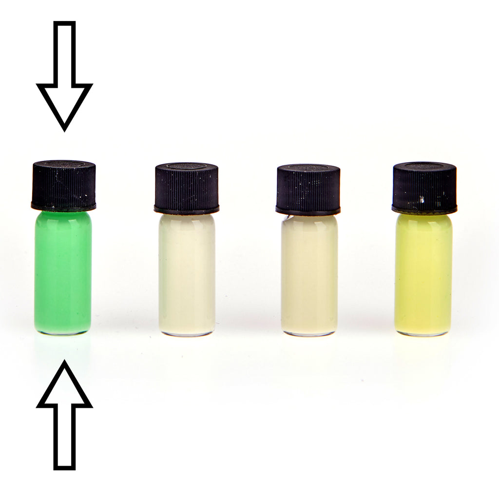 Glow paste: four small vials in green, white, cream and yellow in daylight