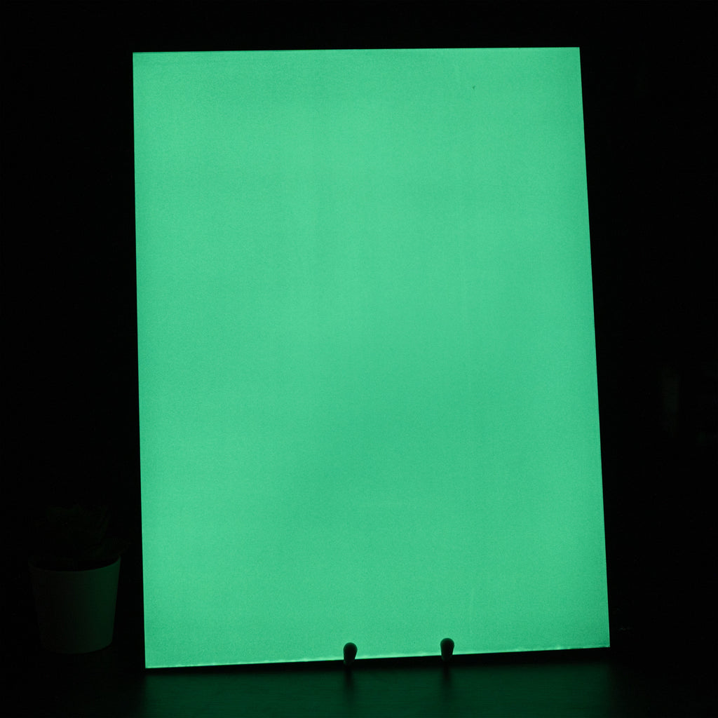 Glow Board A5 on a stand in the dark, glowing green across the whole surface