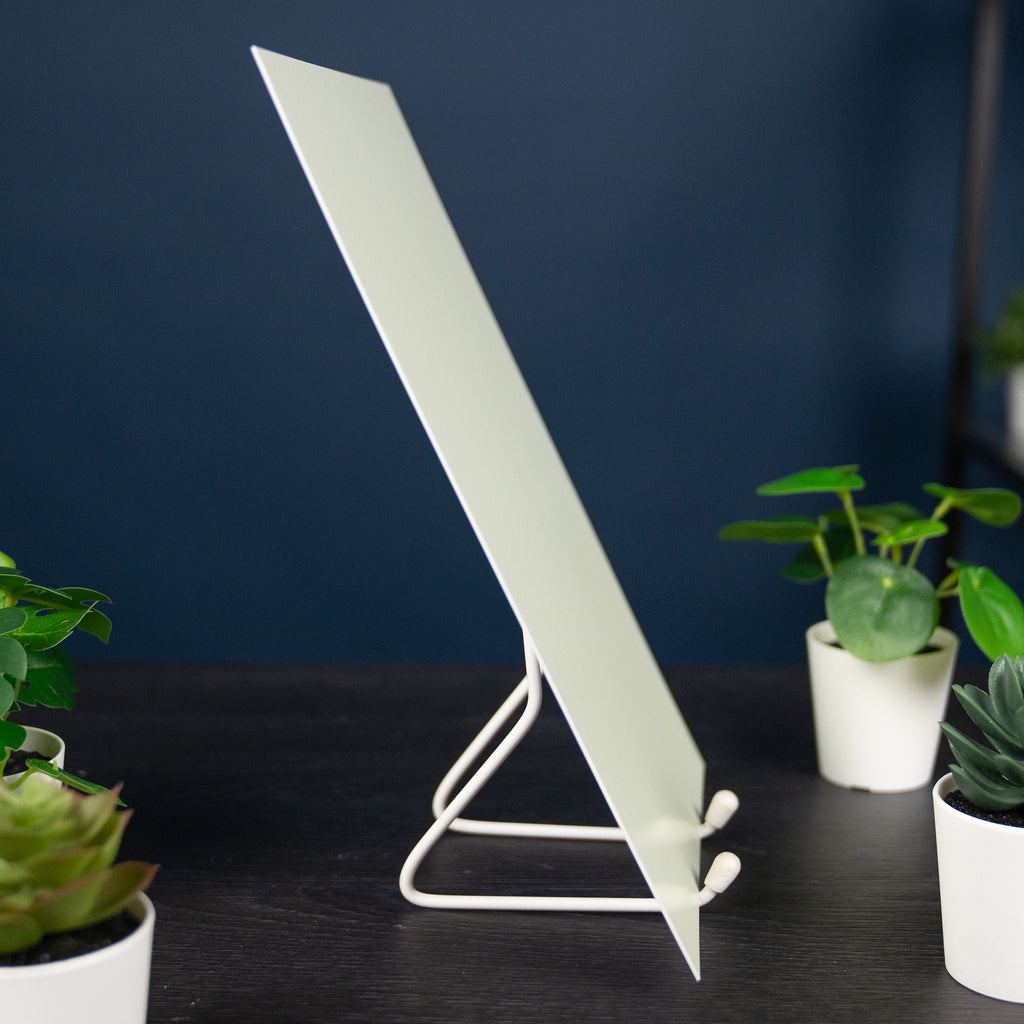 Glow Board A4: side view on a stand between pot plants in daylight