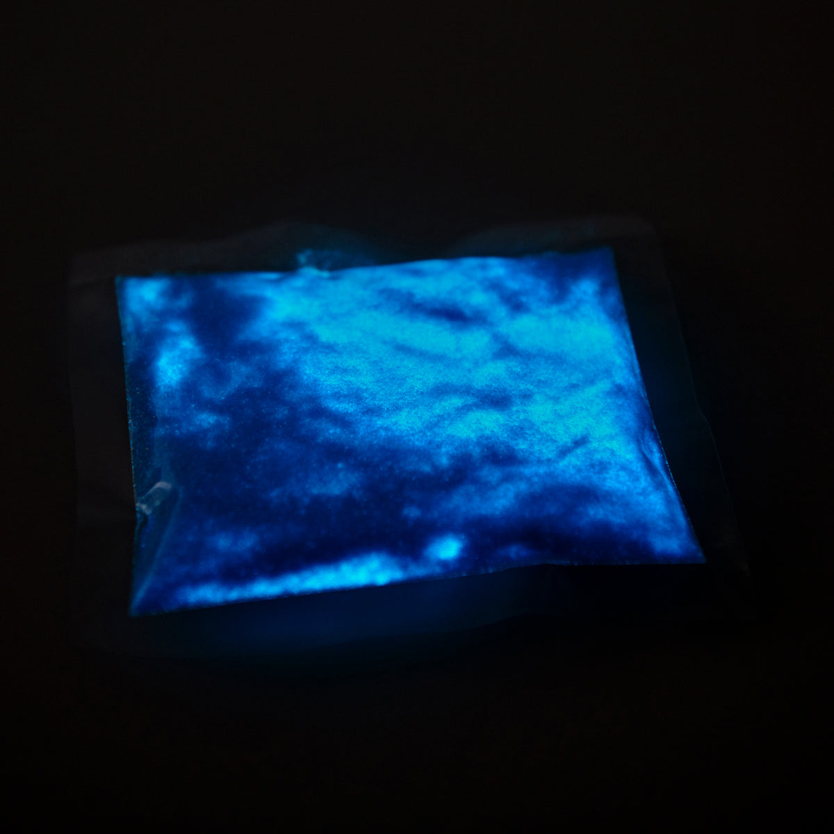 Bag of glitter powder Blue 50 g in the dark, the contents glowing blue