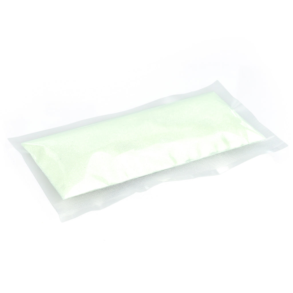 Glitter Powder Green 50 g: pouch with pale green powder in daylight