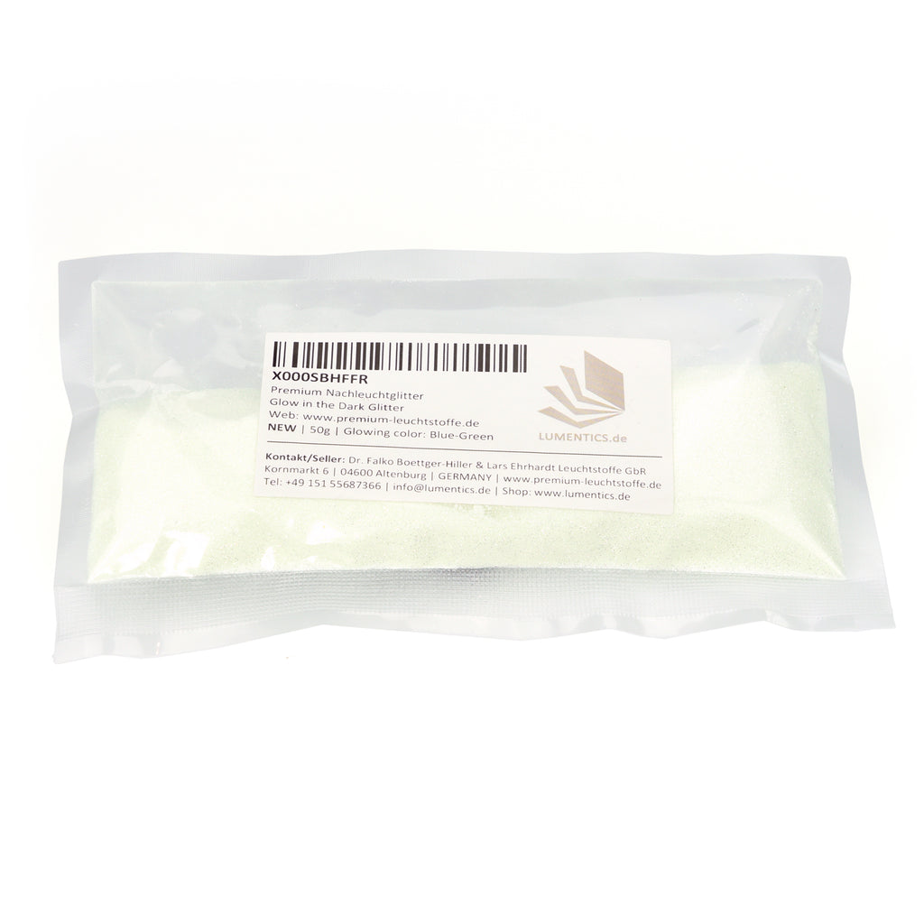 Glitter powder blue-green 50 g in the bag with label, glow colour stated as Blue-Green