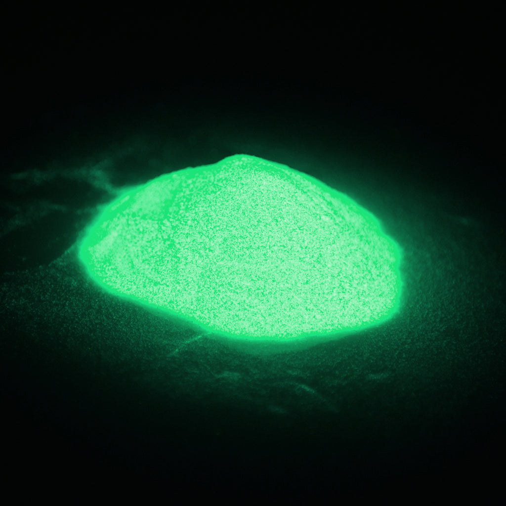 Glitter Powder Green 50 g: small heap glowing green in the dark with visible glitter