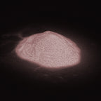 Glitter Powder Rose 50 g as a heap of powder in the dark, shimmering pinkish white