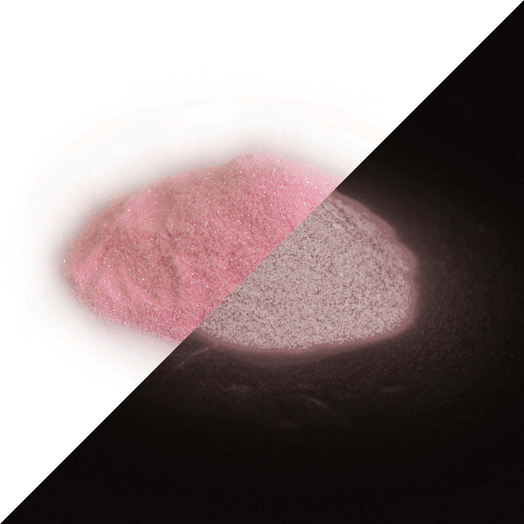 Glitter Powder Rose 50 g: heap of powder, pink and sparkling in daylight on the left, faintly glowing in the dark on the right