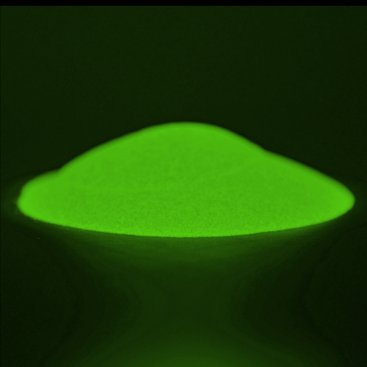 Pile of Glow in the Dark Powder Yellow/Yellow-Green 40 g in the dark, glowing green