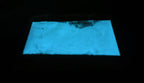 Glow in the Dark Powder Blue 40 g: pouch of powder glowing blue in the dark