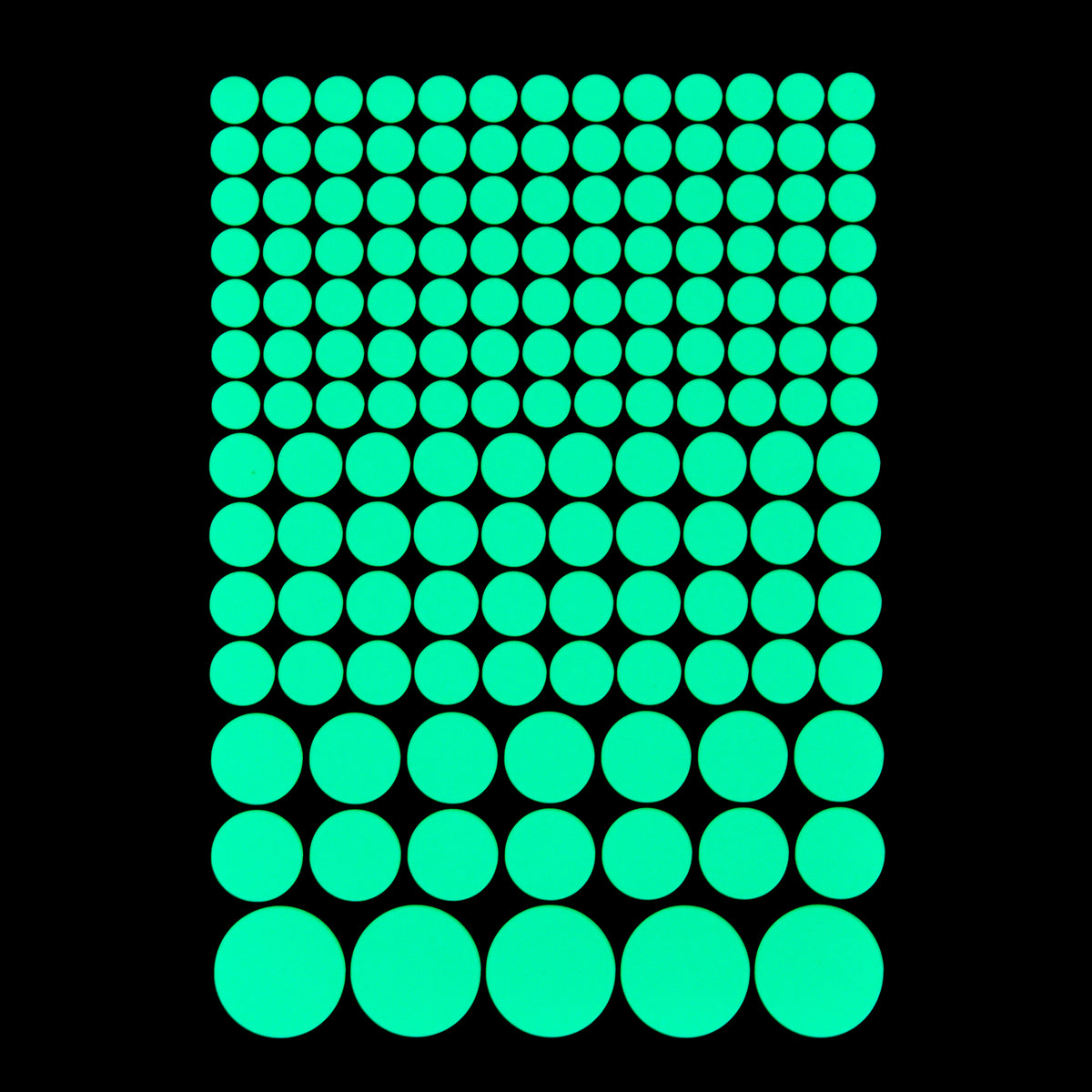 Glow Dots 150 pieces in assorted sizes: sheet glowing green on a black background