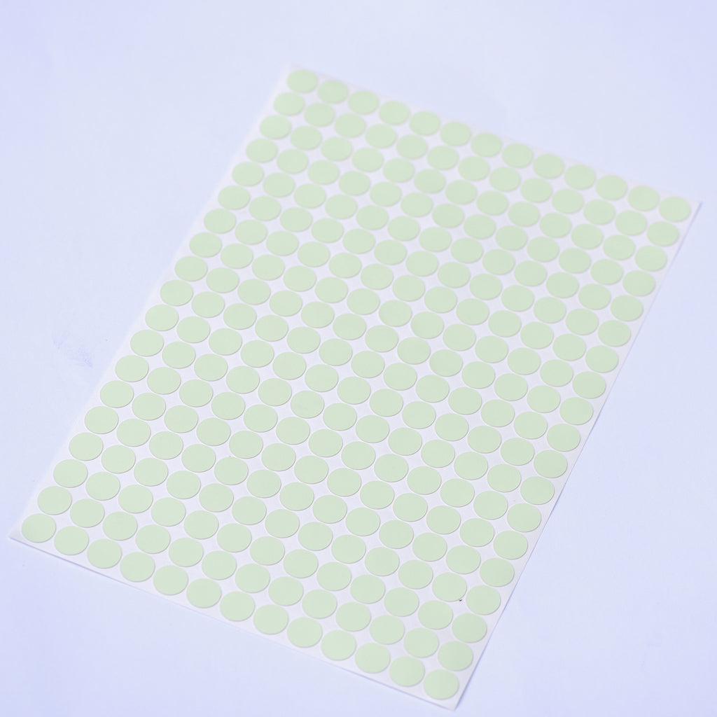 Glow dots 1.5 cm in daylight, sheet lying at an angle with 257 pale green dots