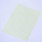 Glow dots 1.5 cm in daylight, sheet lying at an angle with 257 pale green dots