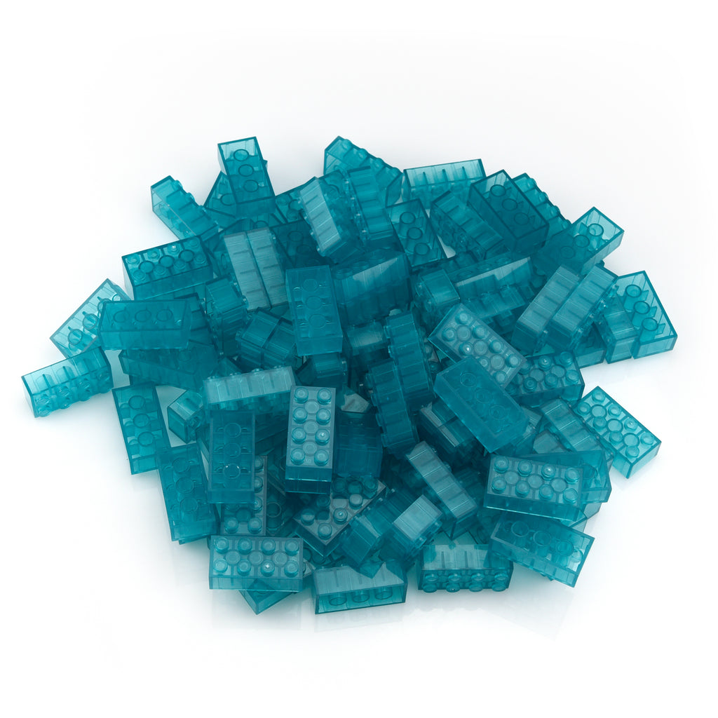 Building bricks 2x4 blue in a pile in daylight, translucent in blue-green