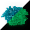 Building bricks 2x4 blue: pile in daylight, split diagonally with green glow in the dark