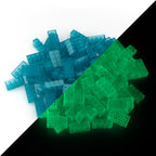 Building bricks 2x4 blue: pile in daylight, split diagonally with green glow in the dark