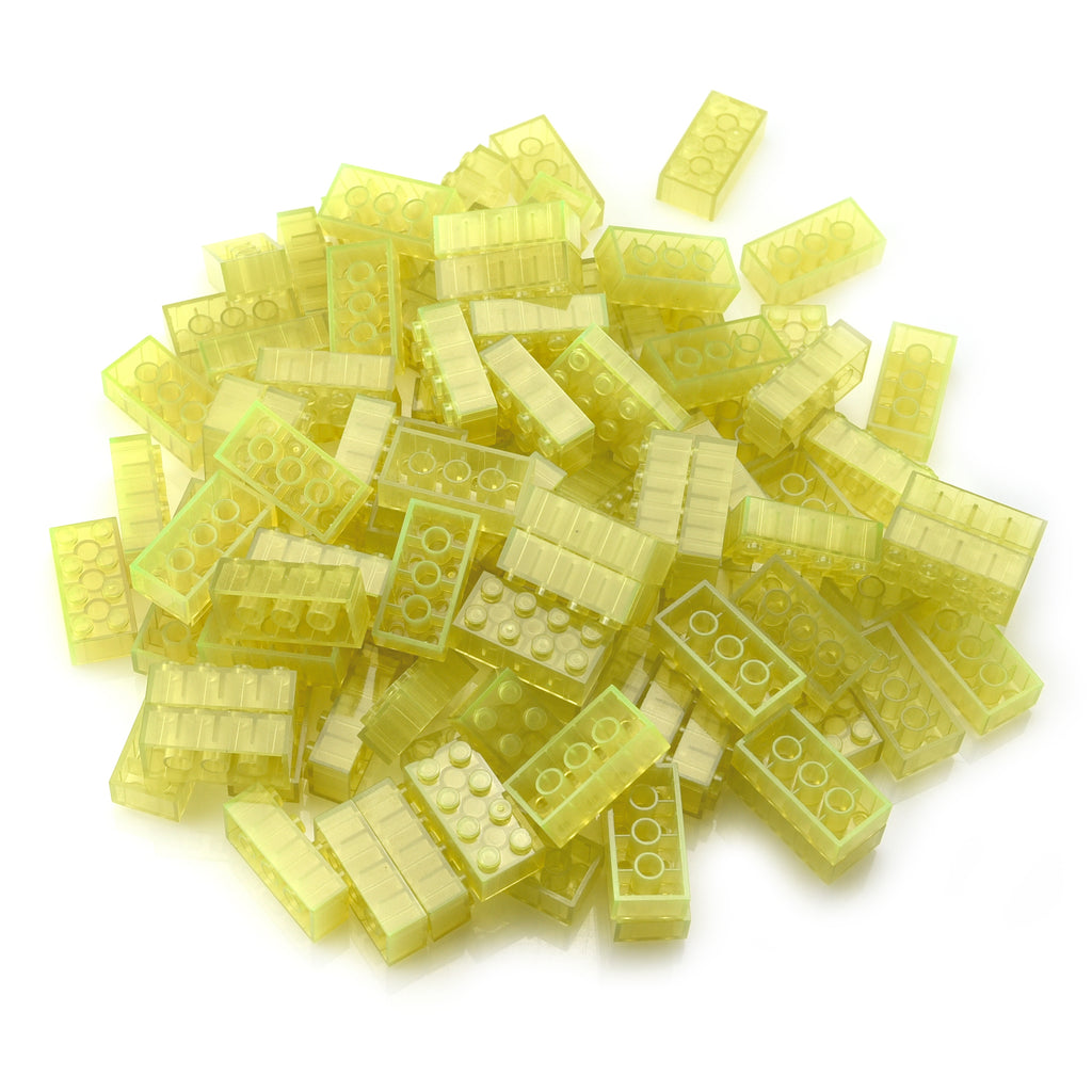 Building Bricks 2x4 Yellow in a pile in daylight, translucent yellow