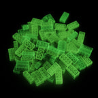 Building Bricks 2x4 Yellow in a pile in the dark, glowing green