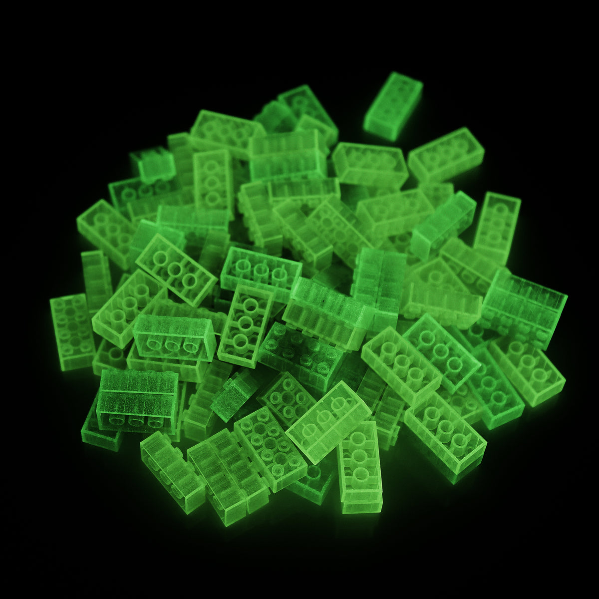 Building Bricks 2x4 Yellow in a pile in the dark, glowing green