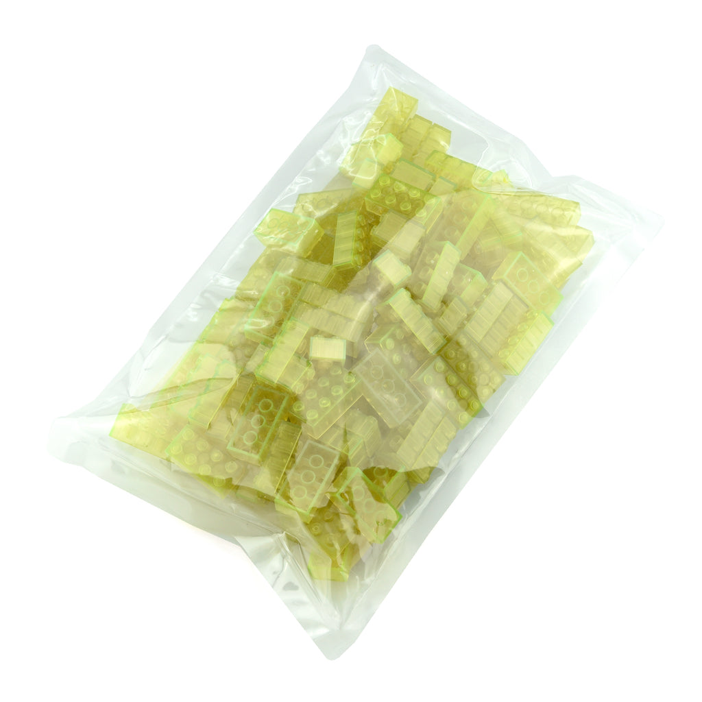 Building Bricks 2x4 Yellow in the clear bag packaging in daylight