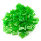 Pile of transparent green 2x4 building bricks in daylight against a white background