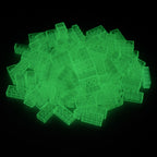 Building bricks 2x4 transparent in a pile, glowing green in the dark