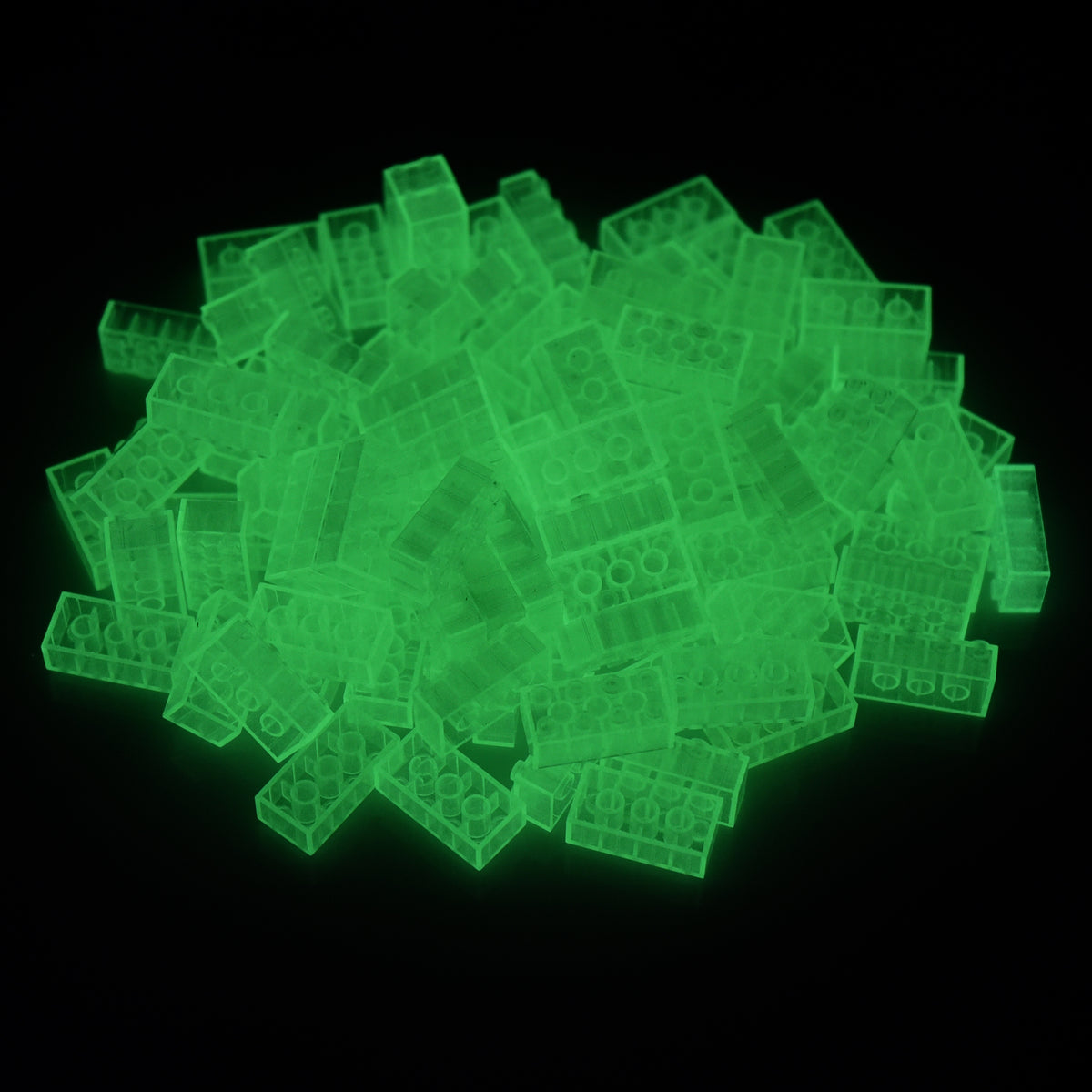 Building bricks 2x4 transparent in a pile, glowing green in the dark