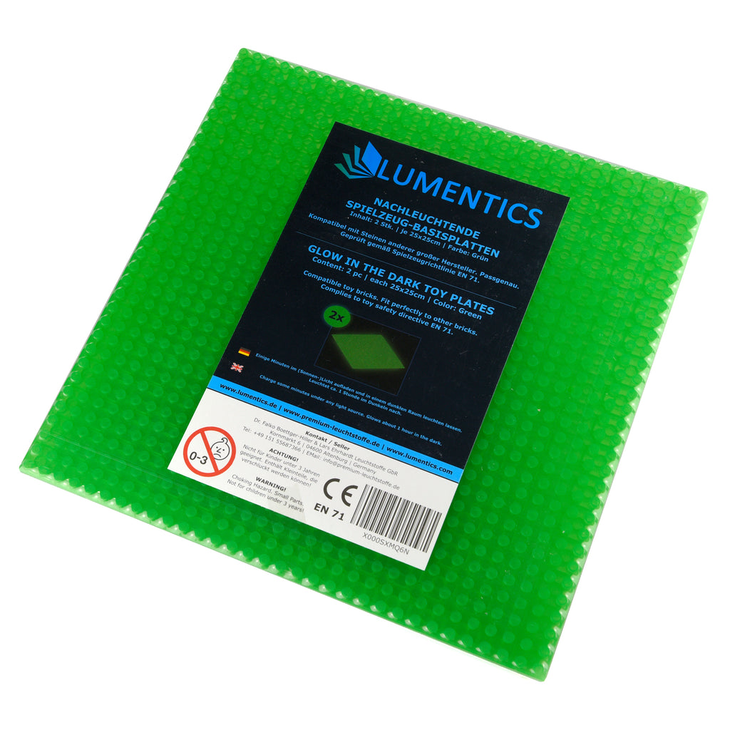 Glow-in-the-dark baseplates green, one plate with packaging label on top in daylight