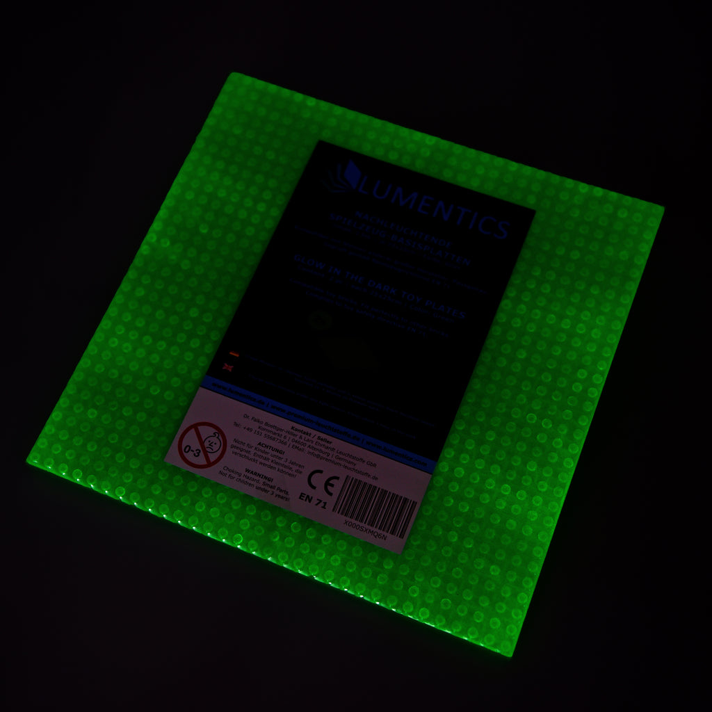 Glow-in-the-dark baseplate green with packaging label, glowing green in the dark
