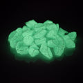 Glow Stones Blue-Green 300 g in the dark, green-blue glowing stones on a black background
