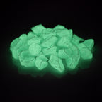 Glow Stones Blue-Green 300 g in the dark, green-blue glowing stones on a black background