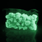 Glow Stones Blue-Green 300 g in their bag in the dark, glowing blue-green